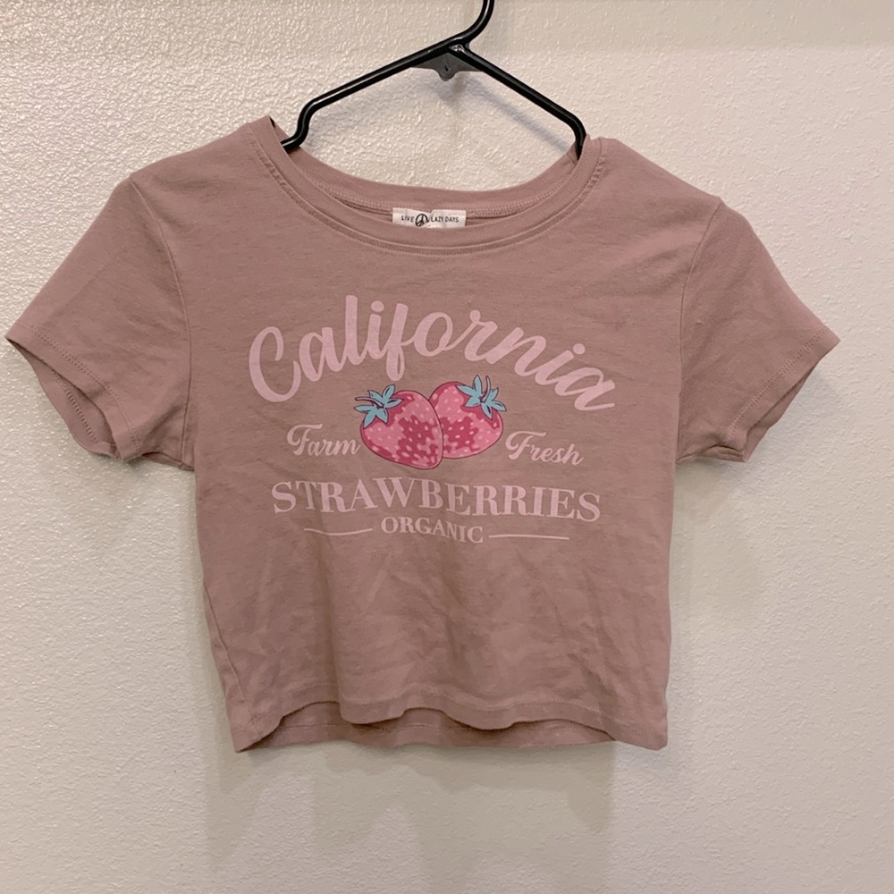 This is a pink cropped shirt with strawberries!